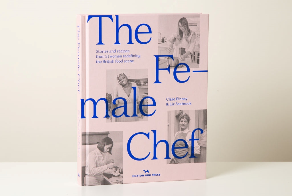 A pink cookbook titled "The Female Chef" by Clare Finney & Liz Seabrook, featuring black and white photos of women cooking.