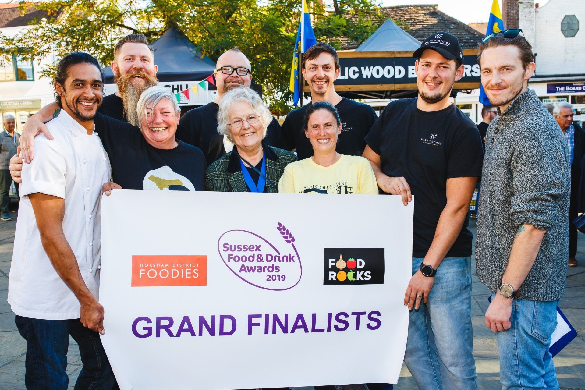 A group of people from The BBQ Project holding a "Grand Finalists" sign for the Sussex Food & Drink Awards 2019.